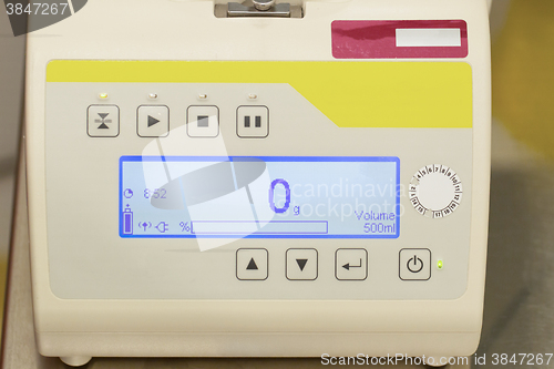 Image of Blood donation process, machine for weighing blood