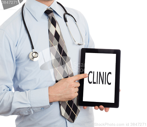 Image of Doctor holding tablet - Clinic