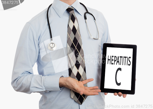 Image of Doctor holding tablet - Hepatitis C