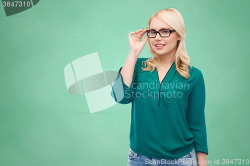 Image of smiling young woman with eyeglasses