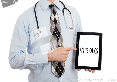 Image of Doctor holding tablet - Antibiotics