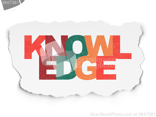 Image of Education concept: Knowledge on Torn Paper background
