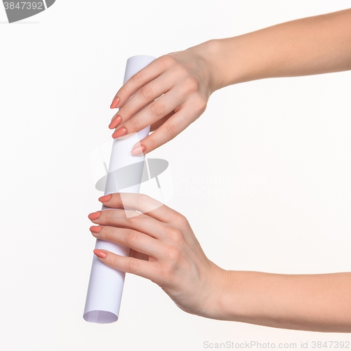 Image of The cylinder female hands on white background