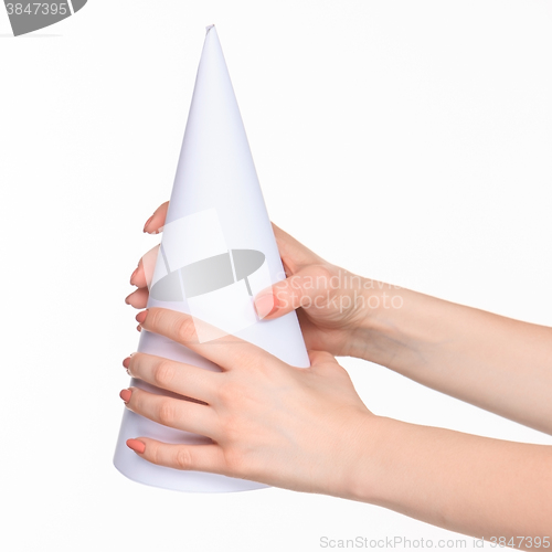 Image of The white cone in the  female hands on white background