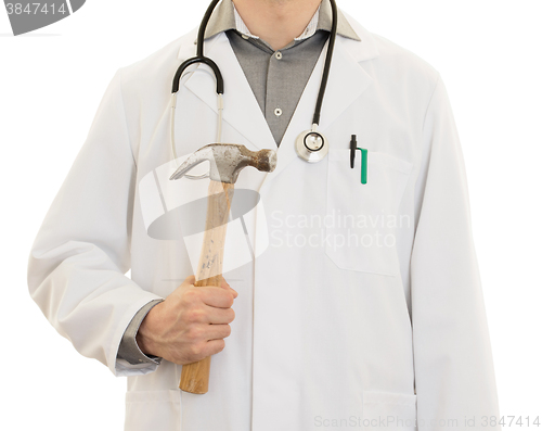 Image of Crazy doctor is holding a big hammer in his hands