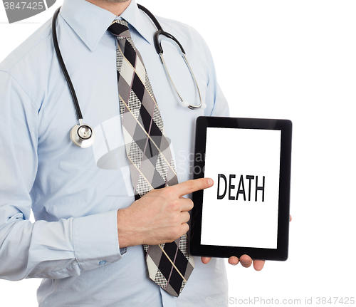 Image of Doctor holding tablet - Death