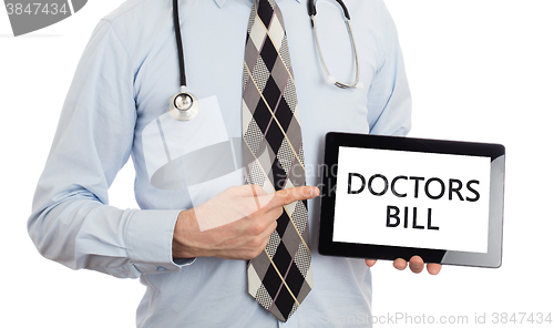 Image of Doctor holding tablet - Doctors bill