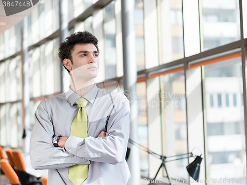 Image of portrait of young business man at modern office