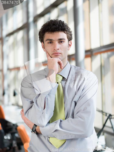 Image of portrait of young business man at modern office