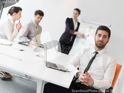 Image of portrait of young modern arab business man  at office