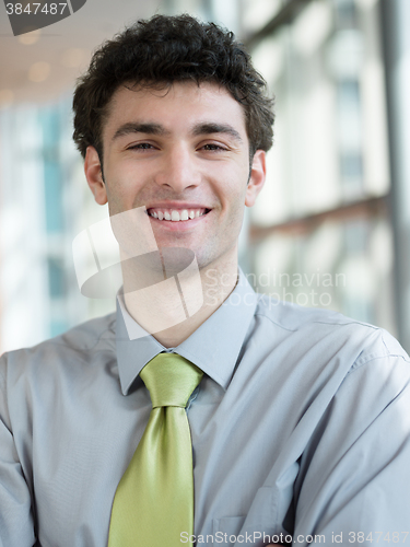 Image of portrait of young business man at modern office