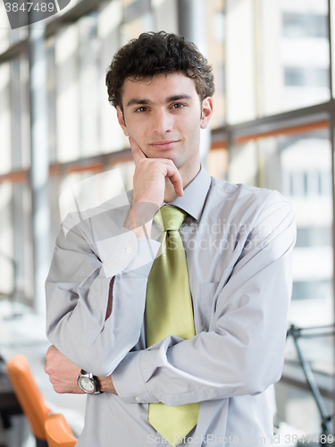 Image of portrait of young business man at modern office