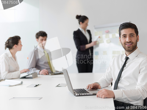 Image of portrait of young modern arab business man  at office