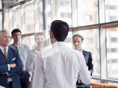 Image of business leader making presentation and brainstorming