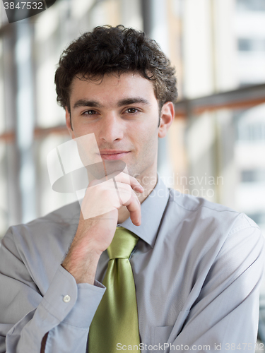 Image of portrait of young business man at modern office