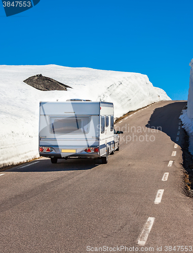 Image of Caravan car travels on the highway.