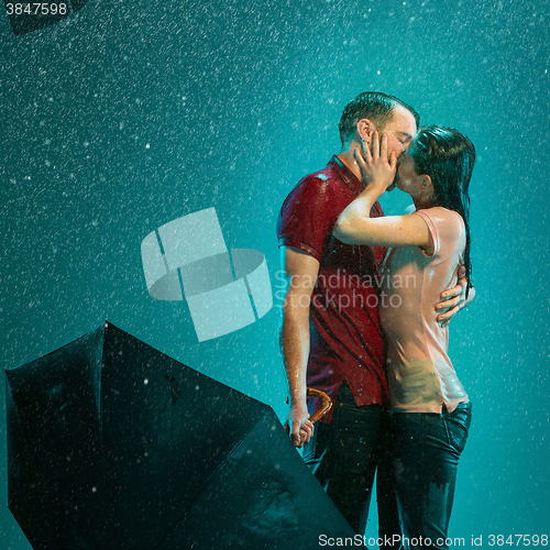 Image of The loving couple in the rain