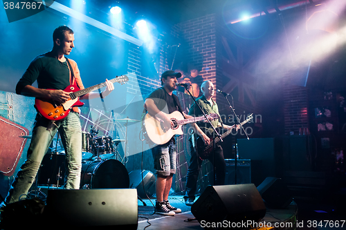 Image of Band performs on stage