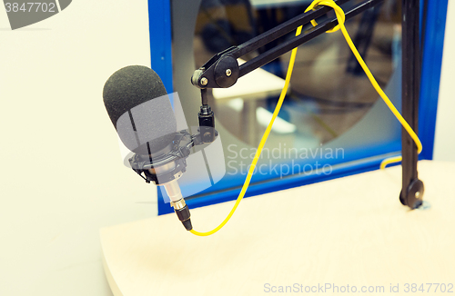 Image of microphone at recording studio or radio station