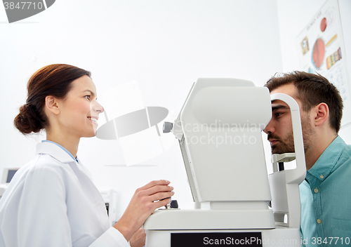 Image of optician with tonometer and patient at eye clinic