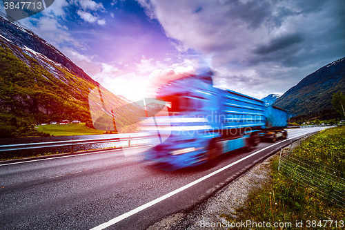 Image of Truck and highway at sunset