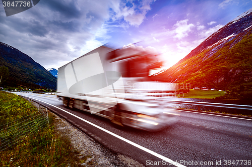 Image of Truck and highway at sunset