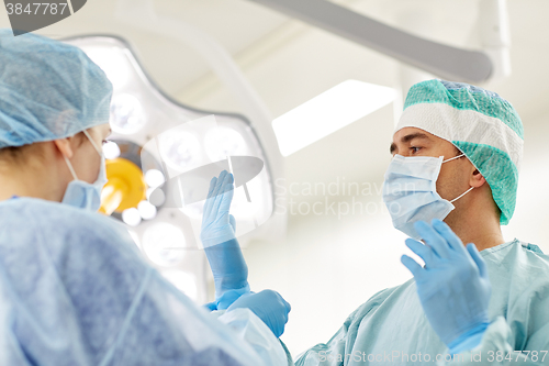 Image of surgeons in operating room at hospital