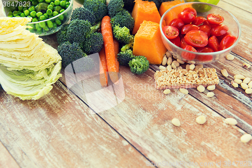 Image of close up of ripe vegetables on wooden table