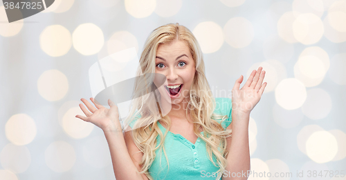 Image of surprised smiling young woman or teenage girl