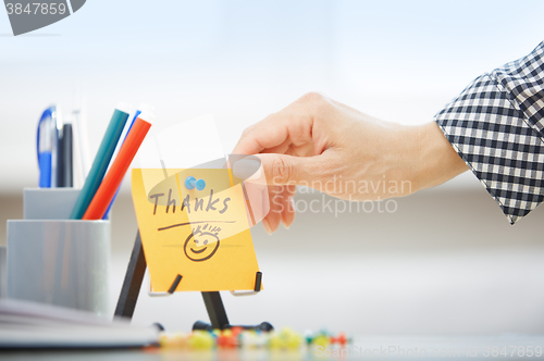 Image of Thanks text on adhesive note