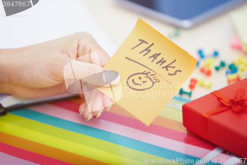 Image of Thanks text on adhesive note