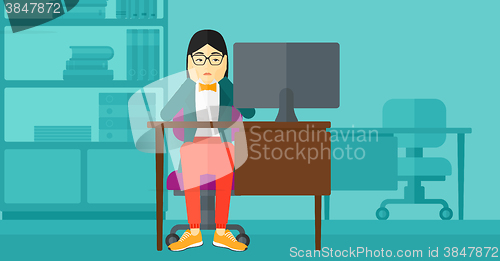 Image of Tired employee sitting in office.