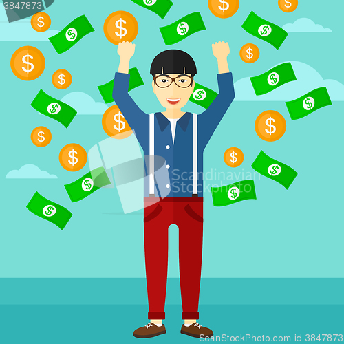 Image of Happy man with  flying money. 