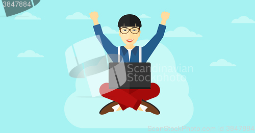 Image of Man sitting on cloud with laptop.