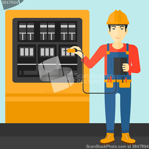 Image of Electrician with electrical equipment.