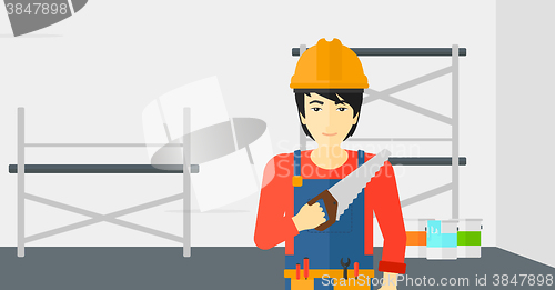 Image of Smiling worker with saw.