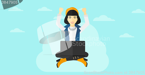 Image of Woman sitting on cloud with laptop.