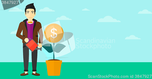 Image of Man watering money flower.