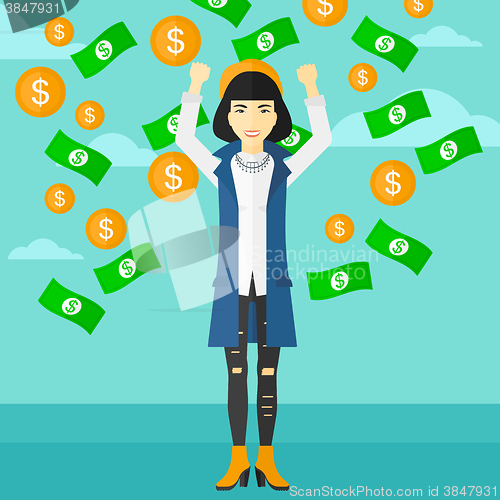 Image of Happy woman with  flying money. 