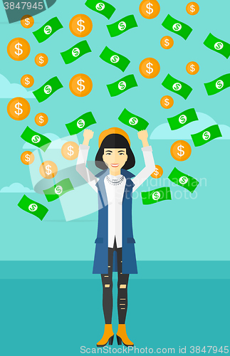 Image of Happy woman with  flying money. 