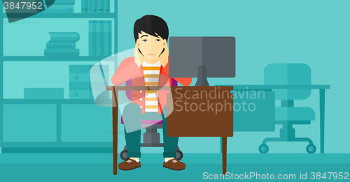 Image of Tired employee sitting in office.