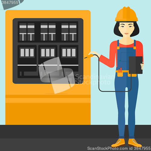 Image of Electrician with electrical equipment.