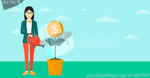 Image of Woman watering money flower.