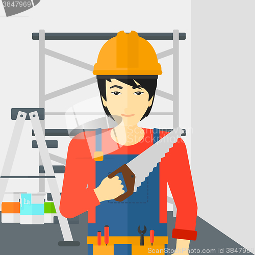 Image of Smiling worker with saw.