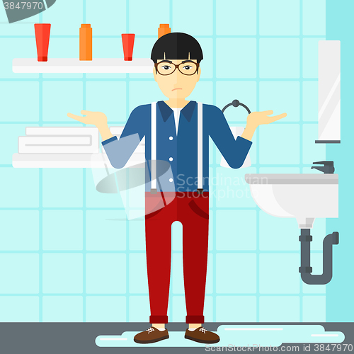 Image of Man in despair standing near leaking sink.