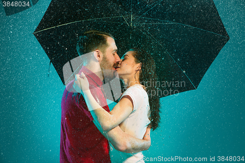 Image of The loving couple in the rain