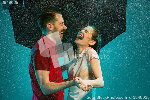 Image of The loving couple in the rain