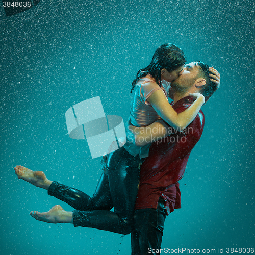 Image of The loving couple in the rain