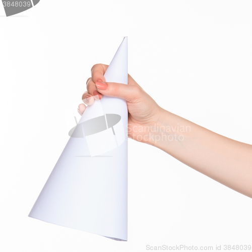 Image of The cone in female hands on white background