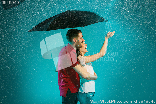 Image of The loving couple in the rain